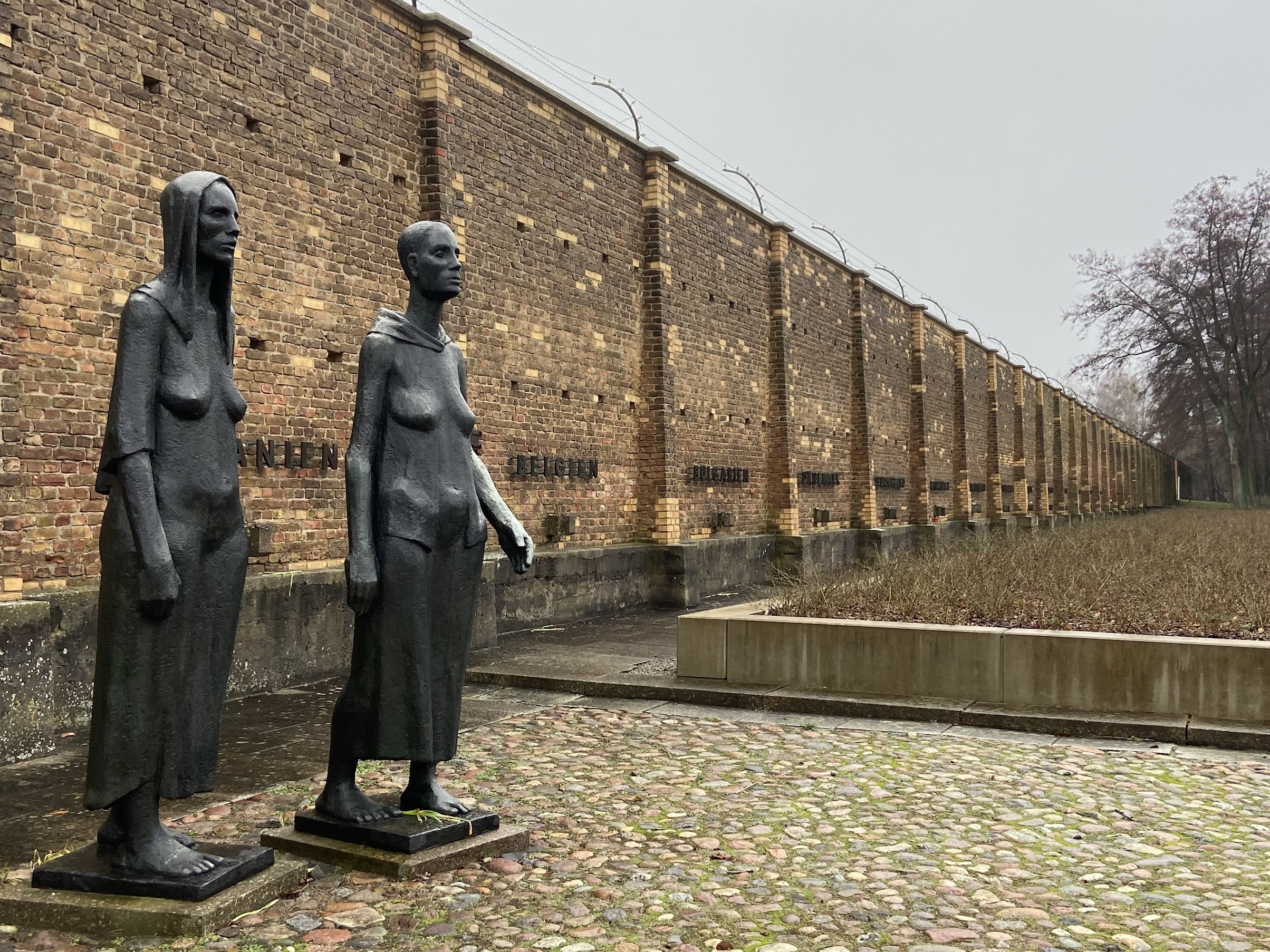 [Photo 14] The Burdened Woman statue and the Wall of Nations.